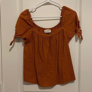 Universal thread burnt orange top
